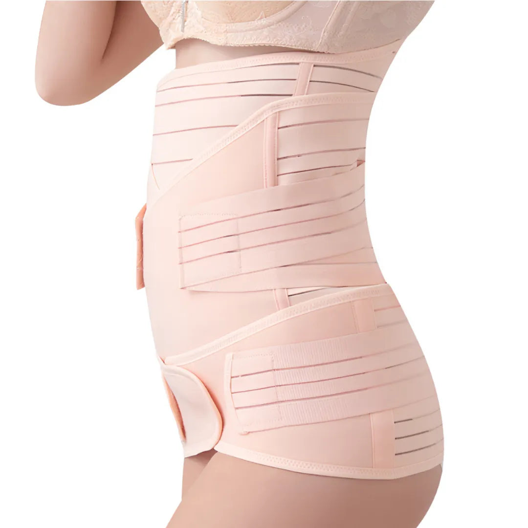 Left side view of a woman wearing a beige maternity support belt for C-section recovery, showing layered support.