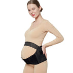 right-side view of a smiling pregnant woman wearing a black baby bump support belt for maternity comfort.