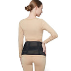 Back view of a pregnant woman wearing a black belly support band for lumbar and lower back support against a white background.