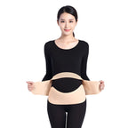 Pregnant Woman wearing a beige belly support belt on a white background