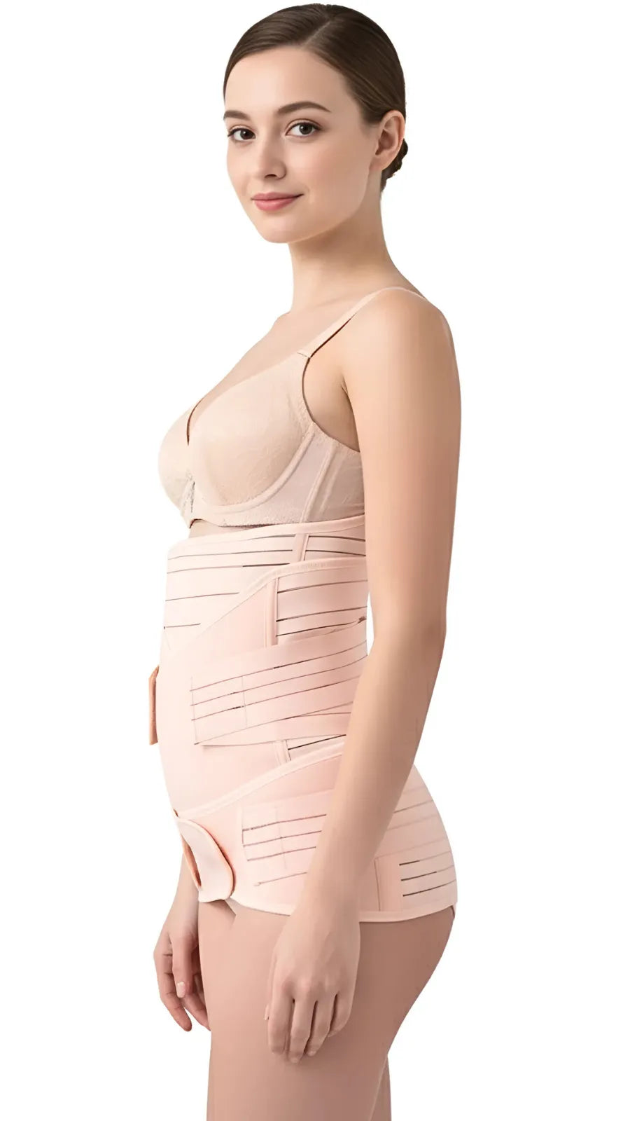 Side view of woman wearing beige postpartum recovery support belt with adjustable Velcro straps on a white background.